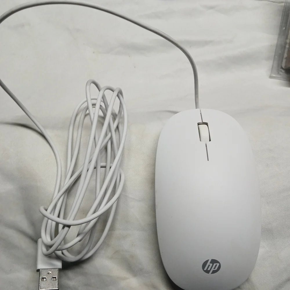 HP wired mouse, potentially model number M54852-001 or HSA-D004K.